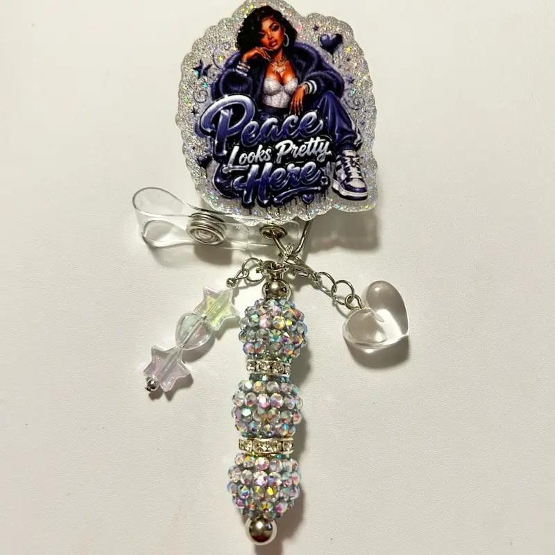 Charmed- Cute trendy retractable badge reel with alligator clip and colorful beads. Charms may vary from photo but will match colors in acrylic piece.