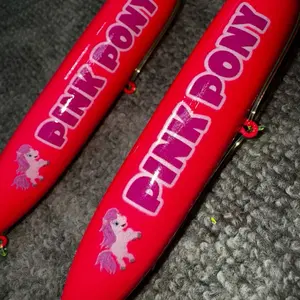 Pink Pony 2 Pack:  Pink Pony (11cm) tied on 4/0 pink fluorescent hooks and 100 pound yellow mono leader lines