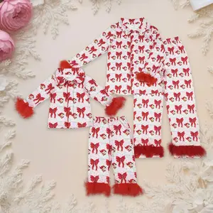 Christmas matching mom–and–me fur pajamas for adult women and girls, featuring a Santa button top and pants with red bows; cute, coordinated fit