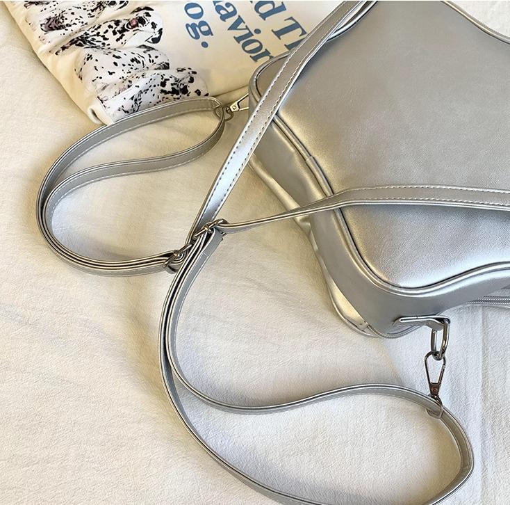 RIVERICH 3-Way Convertible Star-Shaped Ita Bag for Anime & K-Pop Fans, Multi-Strap Acrylic Display Backpack with Removable Shoulder Straps. This unique pentagram bag features a clear window to showcase your pins, charms, and collectibles