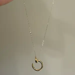 Cadena mini rolon + dije clavo