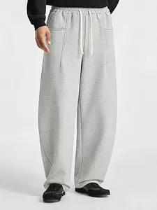 New American curved pants with a drawstring waist, pocket design, solid color, basic style, suitable for casual and athletic wear.