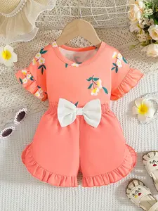 Two piece set of sweet and energetic short sleeved shorts for girls in summer, floral printed top and shorts set for girls, ruffled sleeves and large bow waist cinching, Valentine's Day gift, suitable for family outings, picnic trips, and daily wear