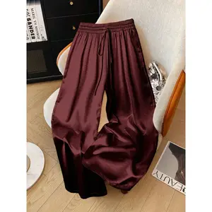 Women’s shiny satin wide-leg pants, casual loose fit with an elastic waistband and pockets; fashionable for all seasons—ideal for home, vacations, and parties. GARMENTARY