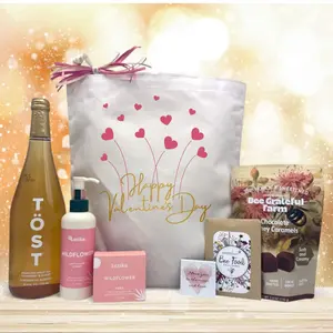 Itsonlynaturalgifts Festive Happy Valentine's Day Gift Basket with TÖST Sparkling Wine, Latika Wildflower Soap, and Bee Grateful Farm Chocolate Honey Caramels