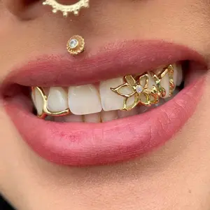 New explosions personality fashion braces flower hollow shape double gold teeth Halloween cool tooth jewelry daily personality tide matching decoration.