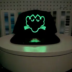 Black Pantera Glow in the dark when exposed to light Black Trucker Hat.