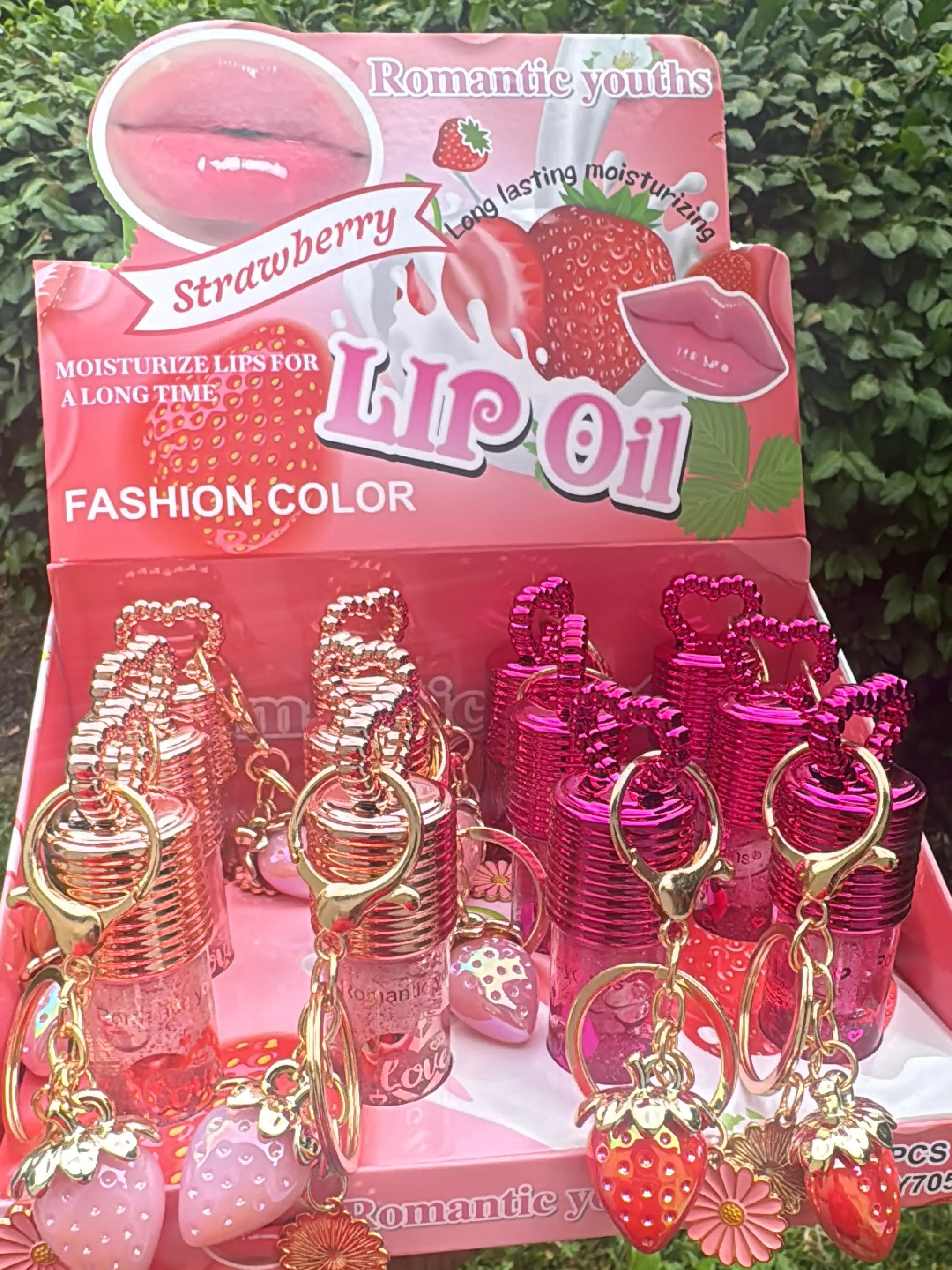 Strawberry lip oil with keychain that activates with pH Gloss Moisturizing