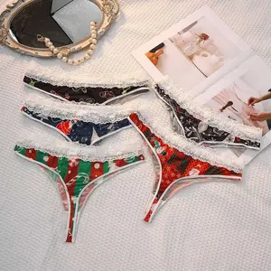 Women's chic Christmas-themed red and green striped thong panties, sexy design with lace trim, snowflake and gift print, sweet and spicy holiday lingerie.