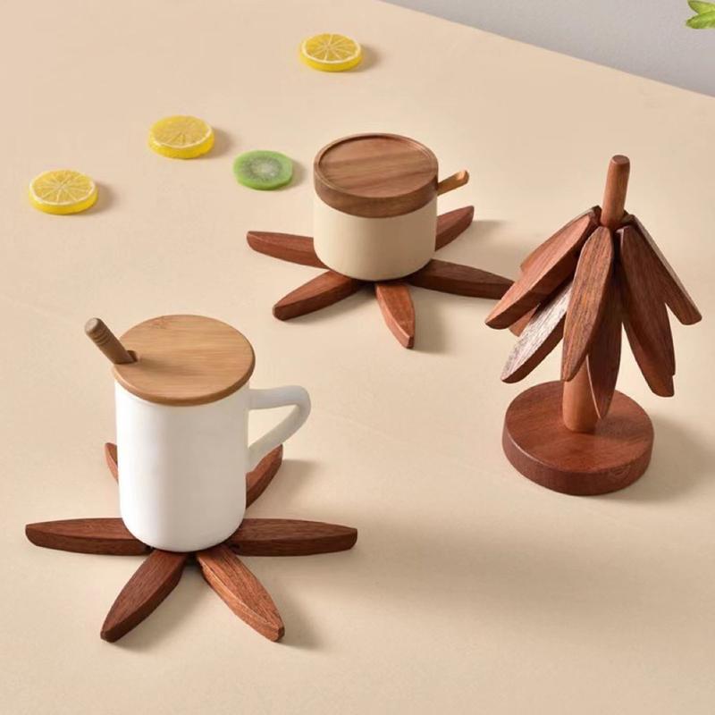 This tree-shaped wooden heat-insulating mat set includes four beech ...