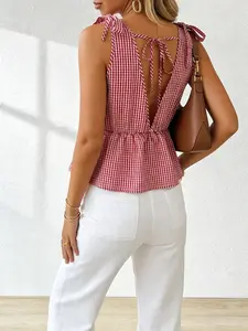 French Coquette Red Gingham Tie Shoulder V-Neck Backless Peplum Top Vintage Y2K Red Gingham Tie Shoulder V-Neck Backless Smocked Crop Top Effortless Chic Red Gingham Tie Shoulder V-Neck Backless Ruffle Cami Top Feminine Womenswear Fit