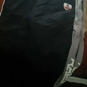 3-pack stylish drawstring jogger pants with side stripes, color-block design, tapered cuffs, loose fit, retro athletic straight-leg cut, breathable fabric, suitable for summer, street-style joggers, practical and versatile Casual