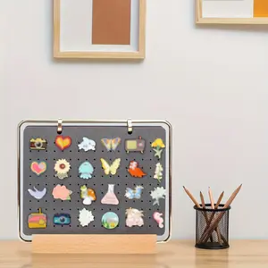 10 pieces of display pins holders, a brooch storage box, and an enamel pin display page with a calendar and display page, which can hold over 180 pins. Comes with a wooden stand (no additional accessories included)