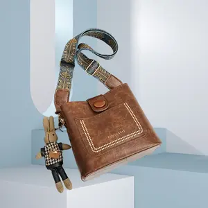 Leather Shoulder Bag for Women with Adjustable Strap and Multiple Pockets - Crossbody Purse with Pendant