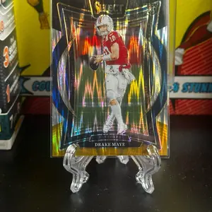 2024 Panini Select Football #27 Drake Maye Black Gold Shock Concourse Prizm RC