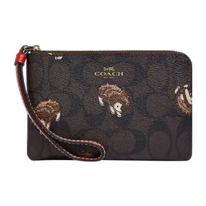 COACH Corner Zip 16 Wristlet with Hedgehog Print and Leather Trim