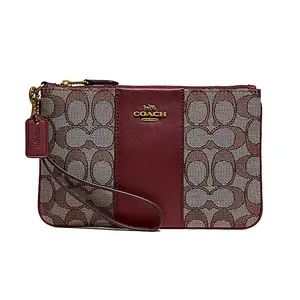 Coach Wristlet in Monogram Canvas with Leather Accents, Small Handbag for Women in Burgundy
