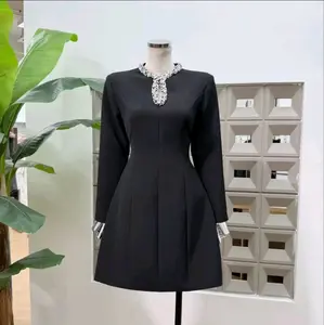 Mini Black Dress with Elegant Beaded Neckline and Long Sleeves for Sophisticated Occasions