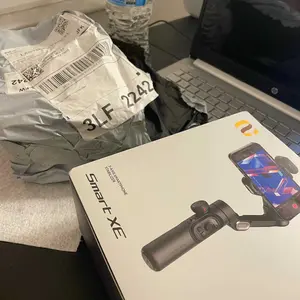 Product Review of Handheld 3 Axis Anti-shake Shooting Stand (1 Count), Rotating Automatic Face Tracking Tripod Stabilizer for Live Video, Phone Accessories, Content Creator Tools from M**e