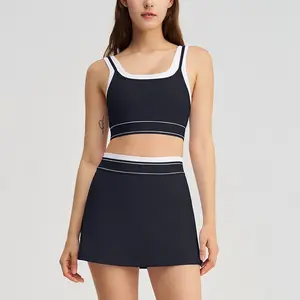 Women's two-piece sportswear set, featuring a color-blocked padded sports bra paired with a high-waisted sports skirt and shorts; perfect for summer tennis and golf.
