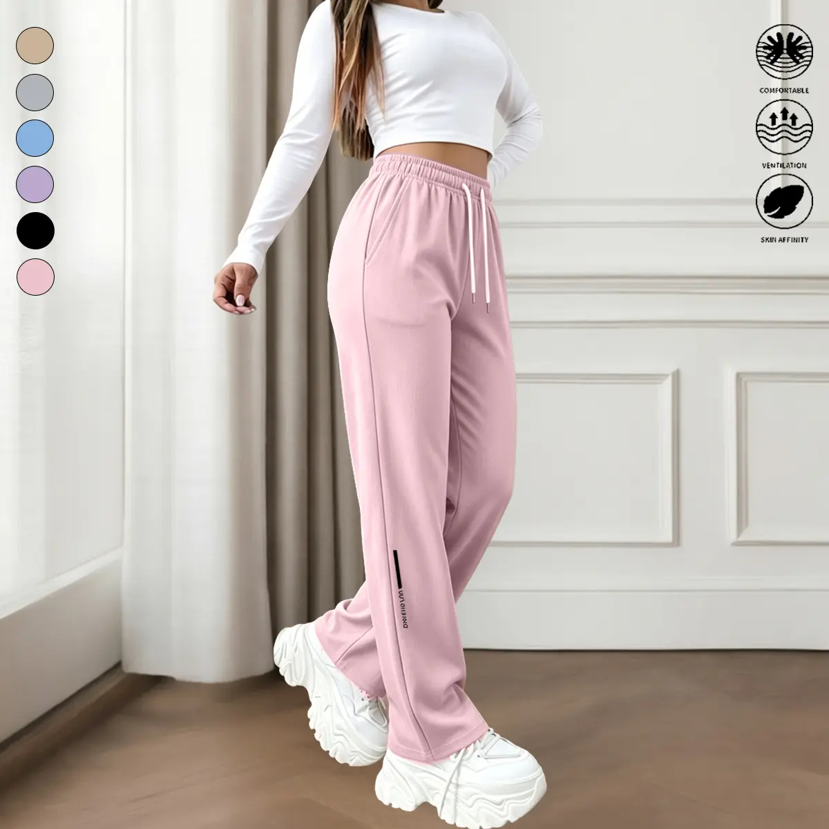 Women’s stretchy wide-leg casual athletic pants with a logo on the side, made from sweat-wicking, breathable fabric, featuring deep side pockets for small items.Loose fit that doesn’t restrict movement—comfortable for outdoor walks and short trips.