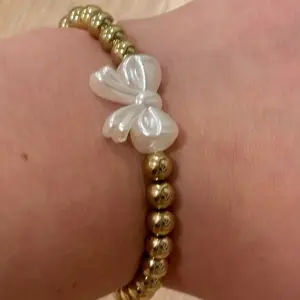 gold pearl bow bracelet