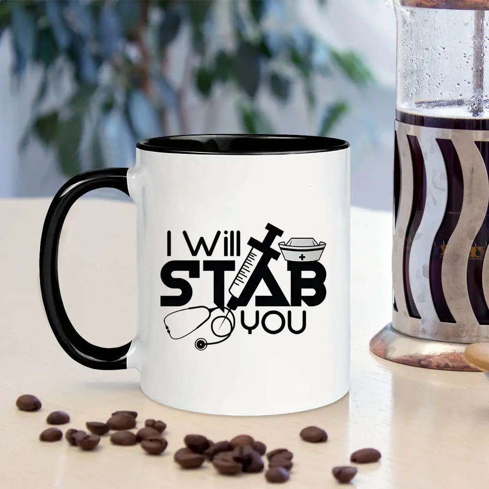 1pc Humorous Medical Hero Coffee Mug - 11oz Large Ceramic Novelty Mug with "I Will Stab You" Design, Vibrant Colors & Durable Construction - Unique Graduation Gift for Nurses, Doctors, Medical Assistants & Nursing Students, Healthcare Worker Gift |   Play