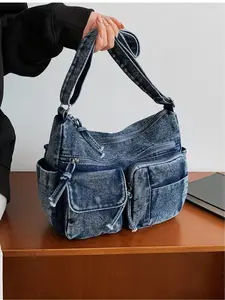 Light blue denim multi-pocket large capacity crossbody bag, vintage distressed workwear style shoulder bag, casual commuting tote bag, Denim Shoulder Satchel, suitable for commuting, shopping, work, campus, casual outings, and everyday accessories