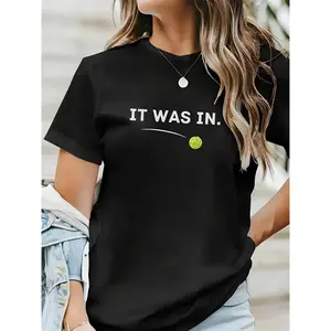 Women's black 180g cotton t-shirt with IT WAS IN print, round neck and short sleeves, casual style perfect for tennis fans and urban fashion, comfortable and light, ideal for summer trend 2023, exclusive graphic t-shirt sporty chic style