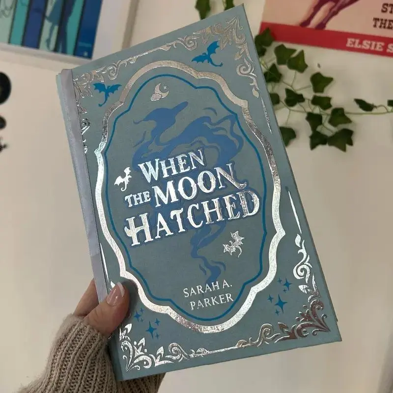 When the Moon Hatched by Sarah A. Parker Special Edition Hardcover Book - Blue Cloth Cover, Silver Foil Dragon Design, Romantasy Book (Office Stationery Notebook Alternative)