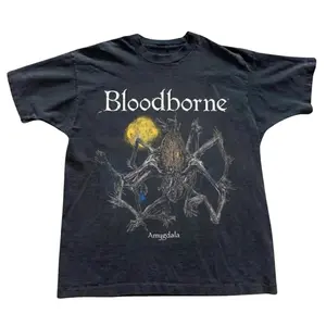 The Bloodborne Amygdala T-Shirt, Gothic Dark Fantasy Game Tee, Moon Monster Graphic Shirt, Soulslike Gamer Gift Tee,, Gift for Men, Gift for Women, Crew Neck T-shirt, Trending T-shirt