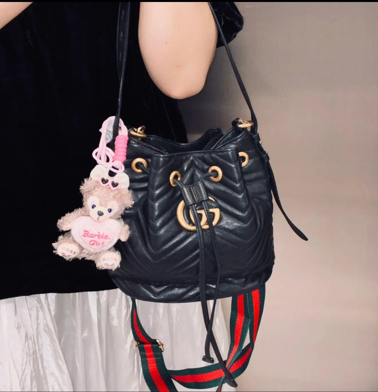 Pre-owned GUCCI GG Marmont Mini Drawstring Bucket Bag Black Chevron Quilt Leather Antique Gold Interlocking GG Web Strap Crossbody Shoulder Handbag