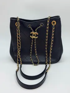 Pre-owned CHANEL 19B Black & Gold Calfskin Drawstring Bucket Bag, Good Condition Limited Edition Egypt Hippie Series, 28 Black Card, Can Be Worn on Shoulder or Crossbody, Lightweight with Large Capacity Size: 23 × 23 × 9 cm