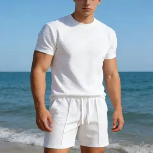 Men’s summer two-piece athletic set: coordinated outfit featuring jacquard fabric with geometric patterns; knit crew-neck short-sleeve T-shirt; elastic drawstring waist; loose-fit shorts; casual everyday wear; suitable for beach vacations; men’s holiday g
