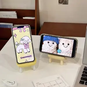 Desktop phone holders with game-changing adjustable viewing angle, crafted from smooth eco resin in multi cartoon animal colorways, mini chair shape & anti-slip base, a must-have cute decor for study desks