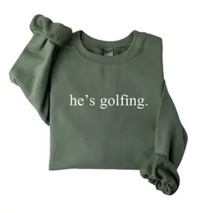 He’s golfing sweatshirt, a cozy golfing season sweater for moms, wives, and golf lovers. Perfect crewneck pullover for players or fans, making a fun and thoughtful gift for any golf enthusiast. - LORA ATCHER