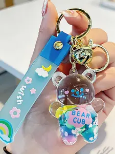 Cute Liquid Quicksand Bear Keychain Bag Charm Kawaii Cartoon Sweet Pastel Aesthetic Style With Shiny Glitter Sequins Gold Bell & Durable Wrist Strap Anti-Lost Metal Clasp For Teen Girls Women Kids Backpack Purse Car Accessories Birthday Gift Party Favors