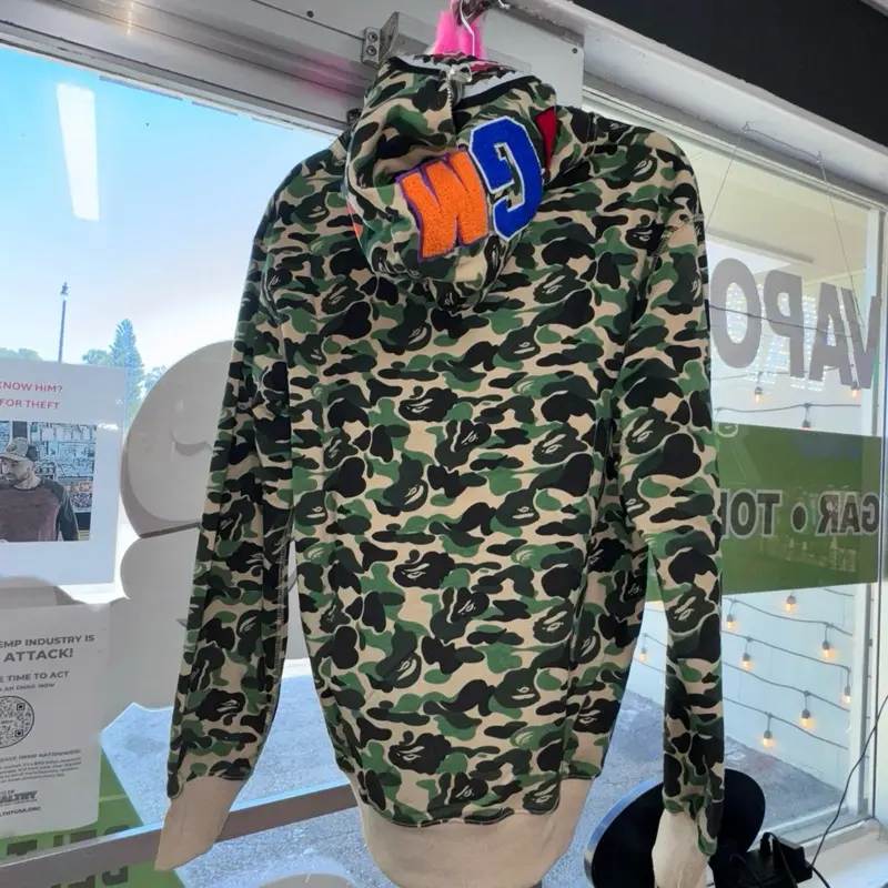 A Bathing Ape Camo Jacket with Orange Logo and Hoodie Design for Men