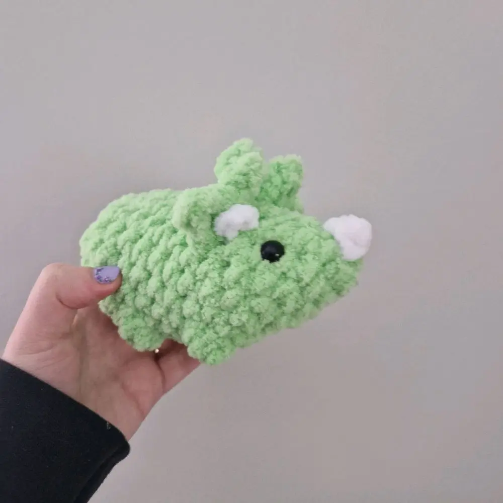 Green handmade plushie triceratops dinosaur crochet amigurumi