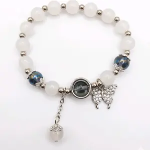 Eclipse Beaded Bracelet with White Beads Blue Accents Butterfly Charm and Dangling Bead for Women