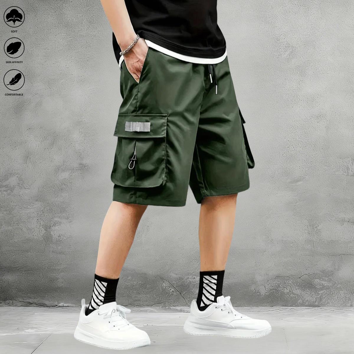New summer men’s tactical cargo shorts with multiple pockets, made from breathable, quick-dry fabric with slight stretch; suitable for casual outings and travel; elastic drawstring waist for relaxed wear.