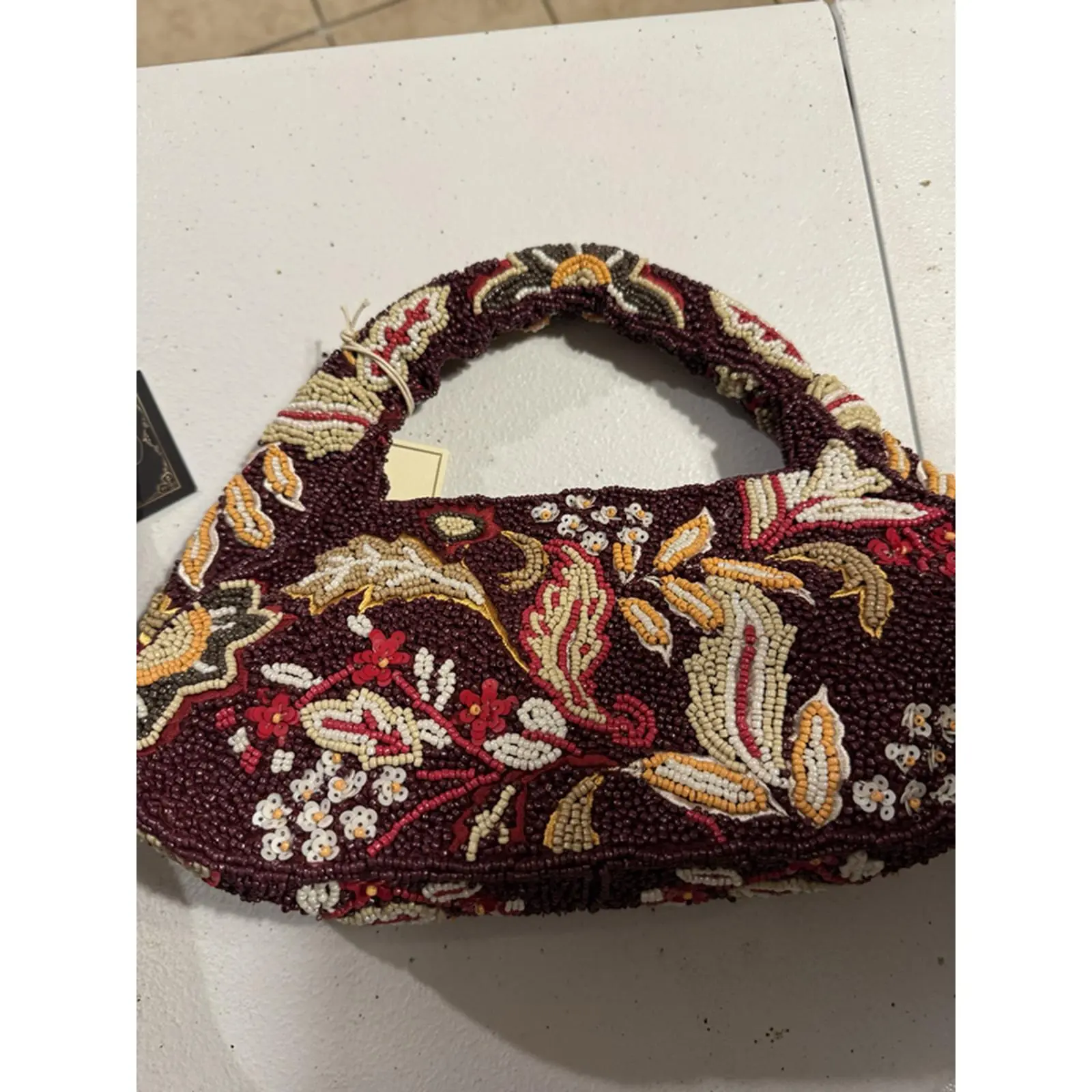 Elegant Floral Beaded Handbag with Intricate Patterns and Rich Colors
