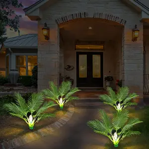 Set of Two Artificial Palm Trees Designed for Outdoor Use, Featuring Solar Lights. Each Tree Stands 25 Inches Tall And Comes Pre-Lit, Making Them Perfect for Christmas Decoration Along Pathways, Yards, Patios, And Sidewalks