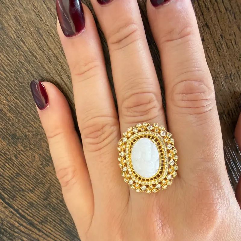 Adjustable Gold plated white Ganesh Ring with multiple stones on it