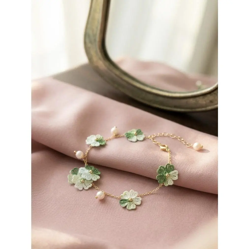 Hand Crafted Micro Crochet Green Flower Bracelet with Pearl Accents and Delicate Chain Design