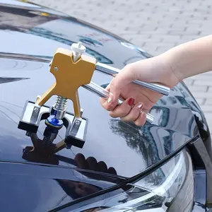 car body dent repair kit includes a dent puller for removing hail damaged and deep dents suitable for unpainted car bodies  kit contains dent repair tools a dent removal puller and a manual dent lifter