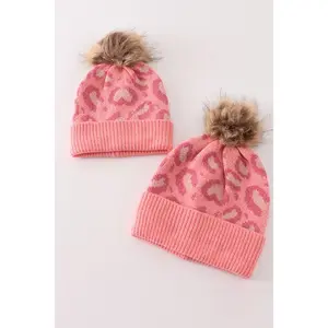 Pink pompom leopard cable beanie