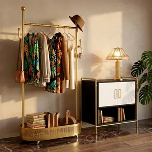 Luxury Gold Coat Hanger Stand with Wheels Space-Saving Organizer for Modern Bedroom or Walk-In Closet Freestanding Design with Storage Baskets and Wheels for Versatile Placement