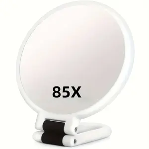 80x handheld magnifying glass with 1X/80X magnification functions. A portable travel makeup mirror featuring a 360° adjustable handle and mirror surface