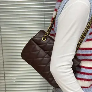 Vintage brown underarm bag, women's lychee-texturedcowhide shoulder bag with crescent lock clasp.